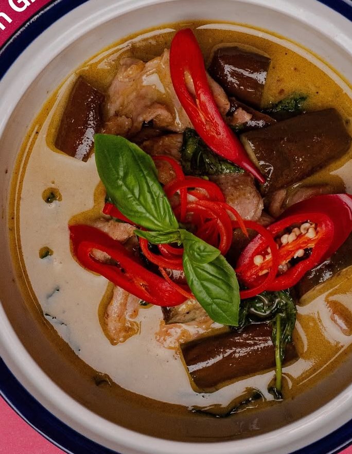Chicken green curry with red chili and Thai basil